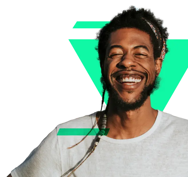 Black man smiling with his eyes closed, wearing a white t-shirt. He has Rastafari hairstyle with hair up, and a green triangle background