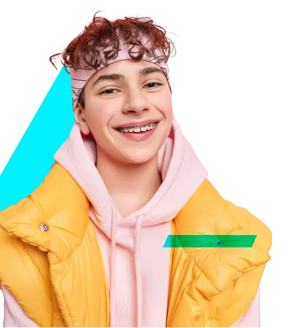 Young woman with light brown, curly hair, wearing a pink headband over her curls, a pink hoodie, and a yellow down vest. She is smiling at the camera with braces, against a blue triangle background