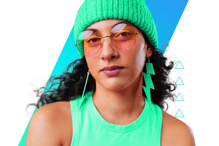 http://Woman%20with%20dark%20curly%20hair%20wearing%20a%20green%20beanie,%20thunder-shaped%20earrings,%20and%20glasses.%20She%20has%20a%20neutral%20expression%20and%20is%20looking%20at%20the%20camera,%20with%20a%20gradient%20skewed%20rectangle%20background